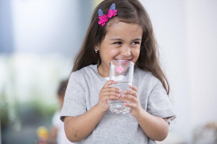 little girl drinking water